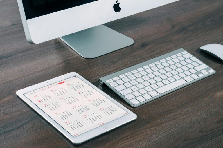 Homeowner marking a pest control schedule on a calendar for regular residential treatments